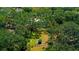 Aerial view of a property with lush greenery and a defined property line at 1613 6Th W St, Palmetto, FL 34221
