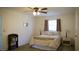 Cozy bedroom with neutral décor, plush bedding, and ample natural light creating a relaxing retreat at 1613 6Th W St, Palmetto, FL 34221