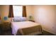Comfortable bedroom with soft lighting, neutral tones, and a cozy bed creating a peaceful atmosphere at 1613 6Th W St, Palmetto, FL 34221