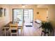 Bright dining room with a breakfast bar and sliding glass doors to an outdoor area at 1613 6Th W St, Palmetto, FL 34221