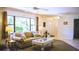 Inviting living room with large windows, cozy furniture, and neutral decor at 1613 6Th W St, Palmetto, FL 34221