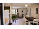 Inviting living area featuring neutral tones, tile flooring, and natural light creating a comfortable atmosphere at 1613 6Th W St, Palmetto, FL 34221