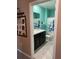 Bathroom with tiled flooring and a shower/tub combo with decorative shower curtain at 16919 Trite Bend St, Wimauma, FL 33598