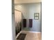 Guest bathroom with tiled floors and walls and a shower/tub combo and a neutral toned shower curtain at 16919 Trite Bend St, Wimauma, FL 33598