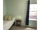 Cozy bedroom with a twin bed and view to the outside at 16919 Trite Bend St, Wimauma, FL 33598
