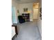 Hallway featuring a book shelf and comfortable armchair at 16919 Trite Bend St, Wimauma, FL 33598