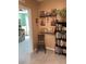 Hallway with carpet and decor on the walls leading into another room at 16919 Trite Bend St, Wimauma, FL 33598