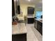 Well-equipped kitchen with granite countertops, stainless steel appliances, and ample cabinet space at 16919 Trite Bend St, Wimauma, FL 33598