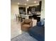Open-concept living room flows into the kitchen with island seating at 16919 Trite Bend St, Wimauma, FL 33598
