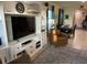 Spacious living room boasts custom built-ins, dining area, and neutral tones at 16919 Trite Bend St, Wimauma, FL 33598