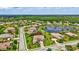 Wide aerial perspective of a residential community featuring homes, landscaping, and a pond at 17003 2Nd E Ave, Bradenton, FL 34212