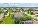 Aerial view of the home showcasing lush landscaping, pool, and neighborhood at 17003 2Nd E Ave, Bradenton, FL 34212