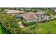 An aerial view of a backyard with a screened-in pool, patio, and manicured landscaping at 17003 2Nd E Ave, Bradenton, FL 34212