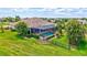 Aerial view of backyard showing screened in pool and lush landscaping at 17003 2Nd E Ave, Bradenton, FL 34212