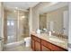 Bathroom with a glass enclosed shower, granite vanity, and modern fixtures at 17003 2Nd E Ave, Bradenton, FL 34212