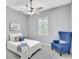 Bedroom featuring an accent chair, carpet, neutral walls, a ceiling fan, and window at 17003 2Nd E Ave, Bradenton, FL 34212
