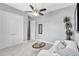Bedroom showcasing ample closet space, neutral walls, carpet, and a ceiling fan at 17003 2Nd E Ave, Bradenton, FL 34212