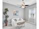Cozy bedroom featuring neutral walls, carpet, a ceiling fan and window that welcomes natural light at 17003 2Nd E Ave, Bradenton, FL 34212