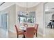 Cozy dining area with elegant chandelier and bay window for a bright and airy feel at 17003 2Nd E Ave, Bradenton, FL 34212