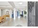 Spacious foyer boasting neutral tile, a grand piano, and elegant decor, bathed in natural light at 17003 2Nd E Ave, Bradenton, FL 34212