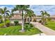 Beautiful home with lush landscaping, brick driveway and meticulously maintained lawn at 17003 2Nd E Ave, Bradenton, FL 34212