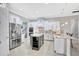 Spacious kitchen features white cabinets, stainless steel appliances, and granite countertops at 17003 2Nd E Ave, Bradenton, FL 34212