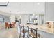Spacious kitchen boasts granite counters, an island with seating, and seamless transition to the dining area at 17003 2Nd E Ave, Bradenton, FL 34212