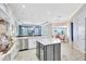 Bright kitchen with an island, granite counters, stainless appliances, and open to dining and living spaces at 17003 2Nd E Ave, Bradenton, FL 34212