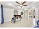 Open-concept living space featuring a grand piano, high ceilings, and plenty of natural light at 17003 2Nd E Ave, Bradenton, FL 34212