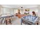 Spacious living room area with plush seating, entertainment center, and game tables at 17003 2Nd E Ave, Bradenton, FL 34212