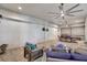 Inviting covered patio featuring comfortable seating, ceiling fans, and a barbecue area, perfect for outdoor gatherings at 17003 2Nd E Ave, Bradenton, FL 34212
