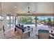 Outdoor patio with ceiling fan and furniture overlooking the screened in pool at 17003 2Nd E Ave, Bradenton, FL 34212