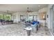 Spacious covered patio offers versatile outdoor living with seating, dining, and lush backyard views at 17003 2Nd E Ave, Bradenton, FL 34212