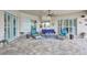 Outdoor patio area features furniture, decor, ceiling fan and view of screened-in pool at 17003 2Nd E Ave, Bradenton, FL 34212