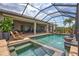 Pool and hot tub in screened enclosure, offering a relaxing escape and seamless indoor-outdoor living at 17003 2Nd E Ave, Bradenton, FL 34212