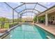 Expansive pool with attached spa and covered patio, perfect for outdoor entertaining and relaxation at 17003 2Nd E Ave, Bradenton, FL 34212