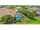 Aerial view showcasing a screened-in pool and patio area with manicured lawn at 17003 2Nd E Ave, Bradenton, FL 34212