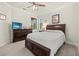 Inviting bedroom featuring a dresser, ceiling fan, and large bed at 17640 Northwood Pl, Bradenton, FL 34202