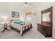 Traditional bedroom with a decorative dresser and an upholstered queen bed at 17640 Northwood Pl, Bradenton, FL 34202