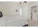 Simple bedroom featuring a view to an adjacent room and a standard queen bed at 17640 Northwood Pl, Bradenton, FL 34202