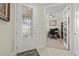 Bright foyer with decorative glass front door and an office just off the entrance at 17640 Northwood Pl, Bradenton, FL 34202