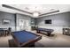 Well-lit game room featuring two pool tables, seating areas, and a relaxing atmosphere at 17640 Northwood Pl, Bradenton, FL 34202