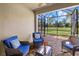 Cozy lanai with comfortable seating and a clear view of the backyard at 17640 Northwood Pl, Bradenton, FL 34202