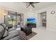 Inviting living room with sliding glass doors and a modern ceiling fan at 17640 Northwood Pl, Bradenton, FL 34202