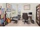 Well-lit home office with built-in bookshelves and large windows at 17640 Northwood Pl, Bradenton, FL 34202
