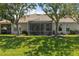 Expansive backyard showcasing a screened-in lanai, perfect for outdoor living and entertaining at 1951 San Silvestro Dr, Venice, FL 34285