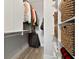Organized walk-in closet with custom shelving, hanging rods, and woven storage baskets at 1951 San Silvestro Dr, Venice, FL 34285