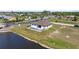 Waterfront home with a private pool and fence close to the canal and surrounding neighborhood at 197 Rotonda Cir, Rotonda West, FL 33947