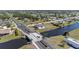 Beautiful aerial view of new construction home with an outdoor pool, located on the water at 197 Rotonda Cir, Rotonda West, FL 33947