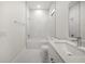 Bright bathroom featuring shower-tub combo and white fixtures at 197 Rotonda Cir, Rotonda West, FL 33947